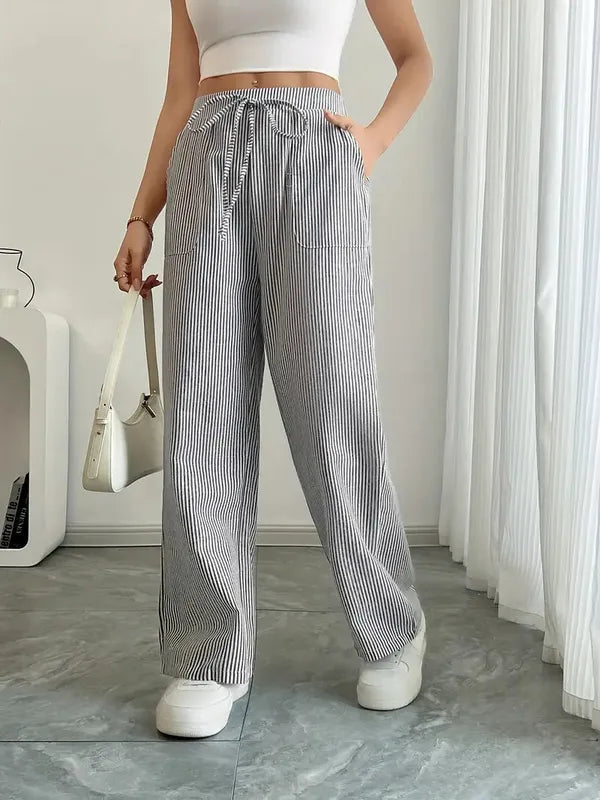 Gray Boho Beach Flare Trousers front view on marble floor with curtain backdrop