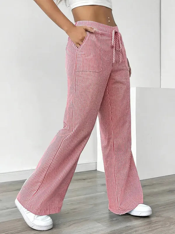 Pink Boho Beach Flare Trousers side profile view with long sweeping flare leg