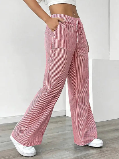 Pink Boho Beach Flare Trousers side profile view with long sweeping flare leg