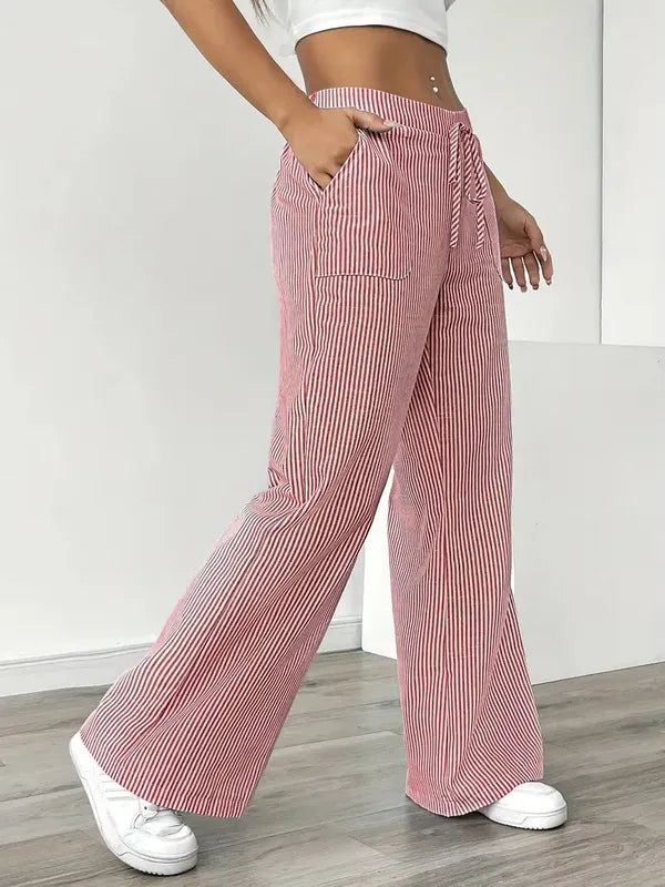 Pink Boho Beach Flare Trousers three-quarter view with ribbed texture close up