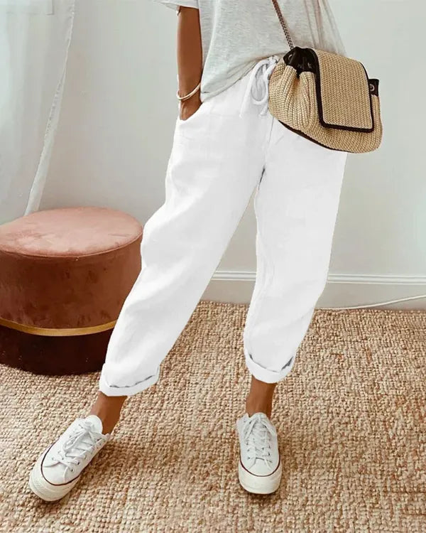 White Coastal Tapered Lounge Pants front view with relaxed leg and side pockets