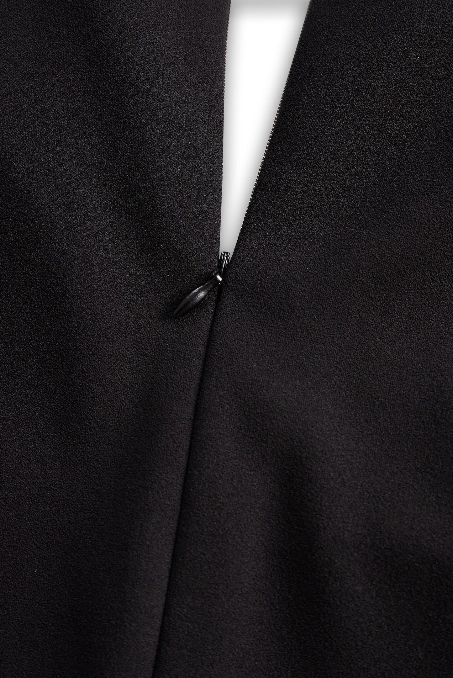 Back zip closure detail on the Camille women's black cocktail bodycon midi dress