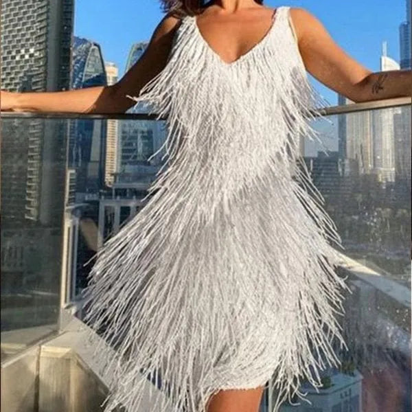 White Rosalind fringe cocktail mini dress front view on a city balcony