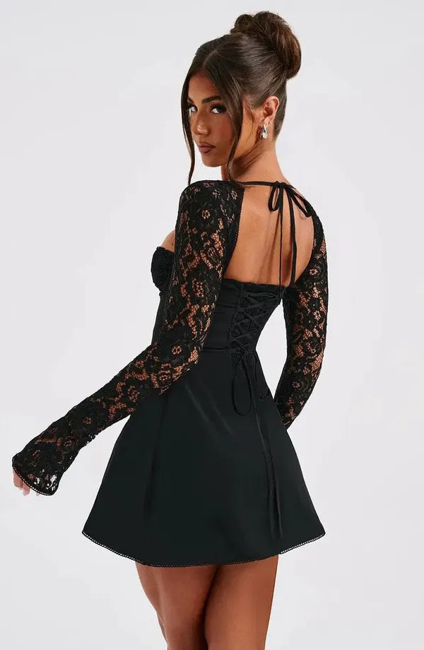 Back view of the black Cordelia lace mini dress with the corset tie back