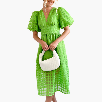 Green Aurelie women's cocktail puff sleeves midi dress, front view with handbag