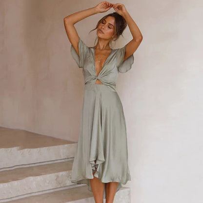 Green Marta midi dress with flutter sleeves and twist cut-out waist, front view
