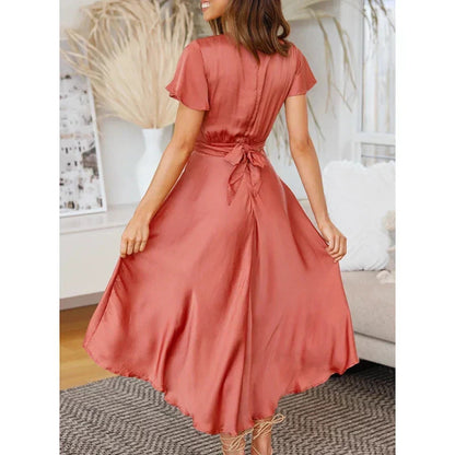 Back view of the red Marta uneven hem cocktail midi dress with tie waist bow