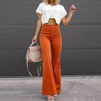 Orange Corduroy Flare Trousers styled front view with cropped knit and heels
