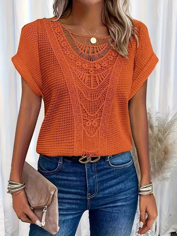 Svea Women's Crochet Knit Short Sleeve Top in orange, front view with crochet lace trim
