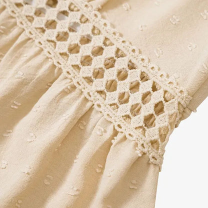 Detail of the crochet lace trim on the beige Abigail flutter sleeve dress