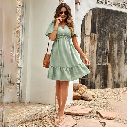 Abigail crochet lace flutter sleeve mini dress in sage green, front view outdoors