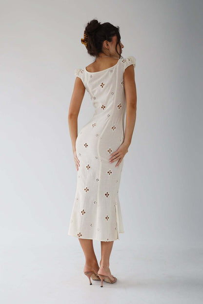 Back view of the white Adelina cut-out fitted midi dress with scoop back