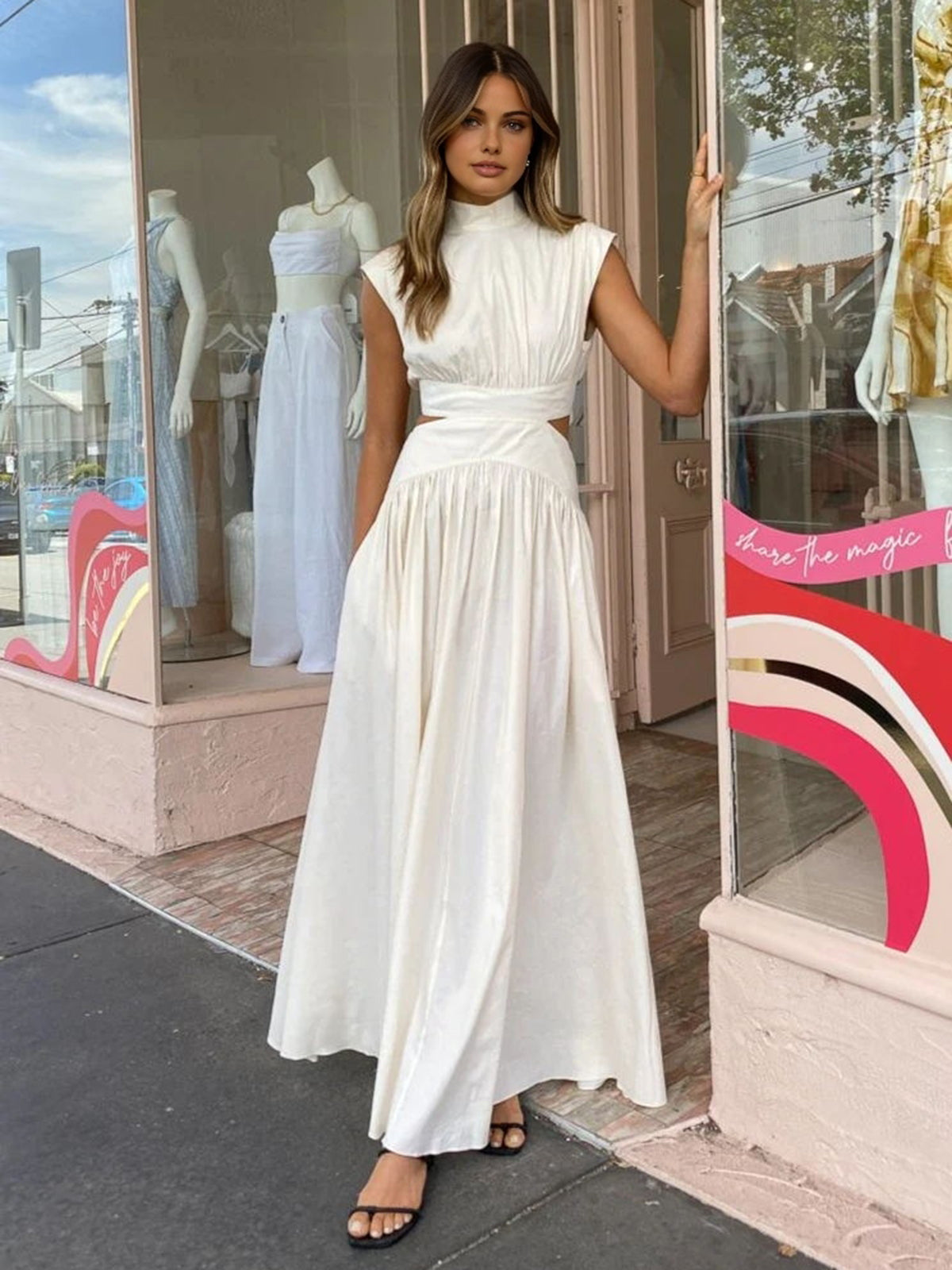 Women's Cut-Out Maxi Dress in White, full-length front view on a street - Amely