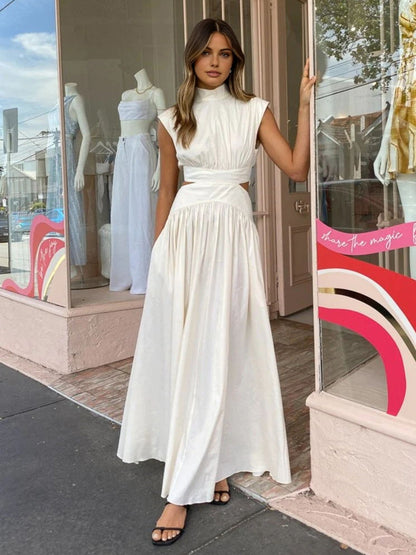 Women's Cut-Out Maxi Dress in White, full-length front view on a street - Amely