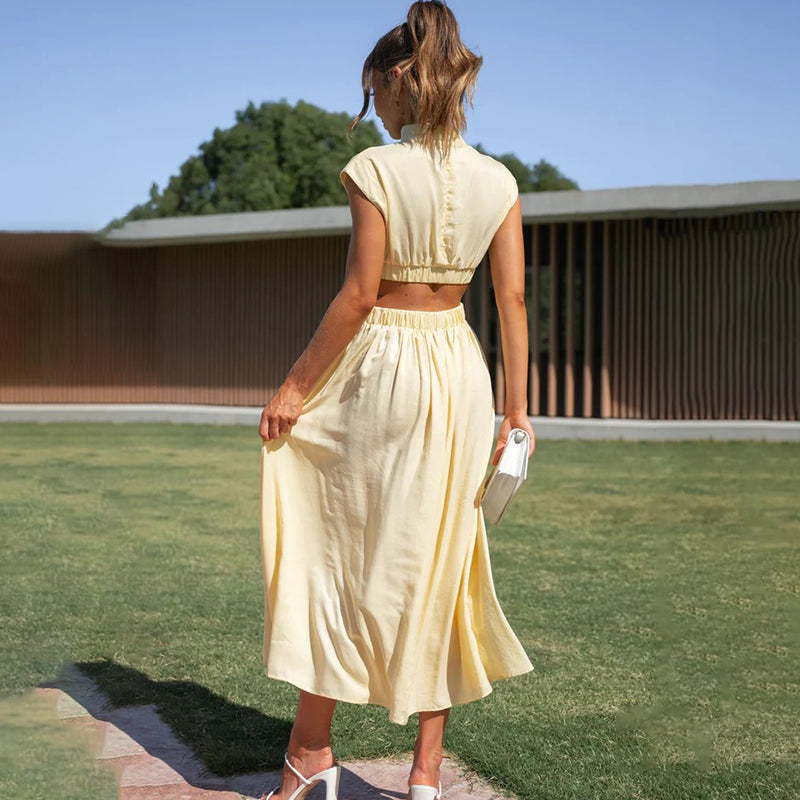 Women's Cut-Out Waist Maxi Dress in Yellow, back view on the lawn - Mirella