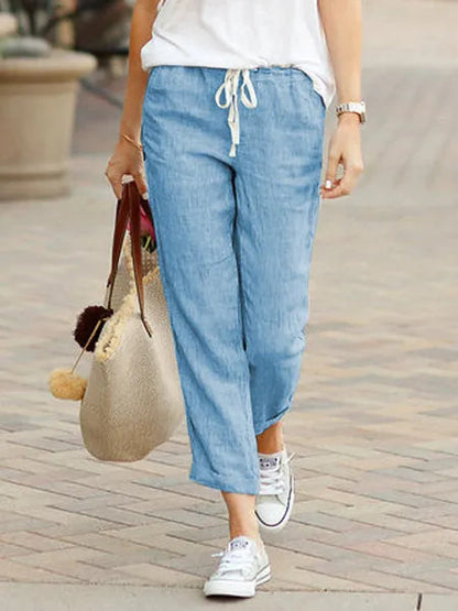 Madeline Women's Drawstring Linen Trousers in light blue, front view on model