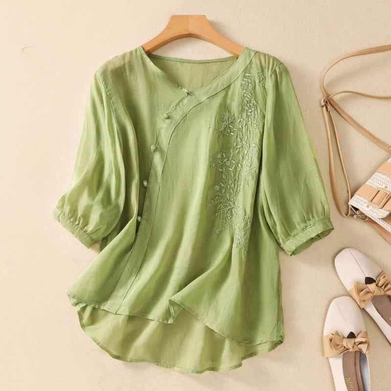 Women's Embroidered Mid Sleeve Blouse in Sage Green, flat lay on a hanger – Kalina