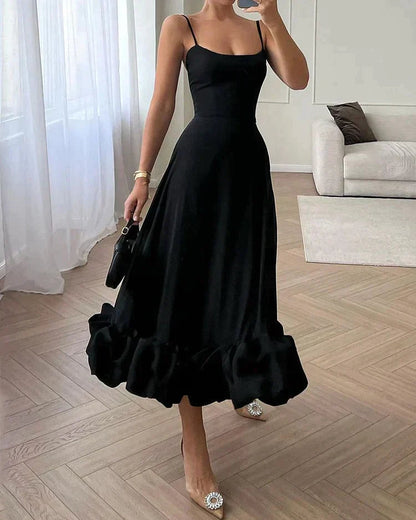 Lotta fitted sleeveless midi dress in black with dramatic ruffle hem