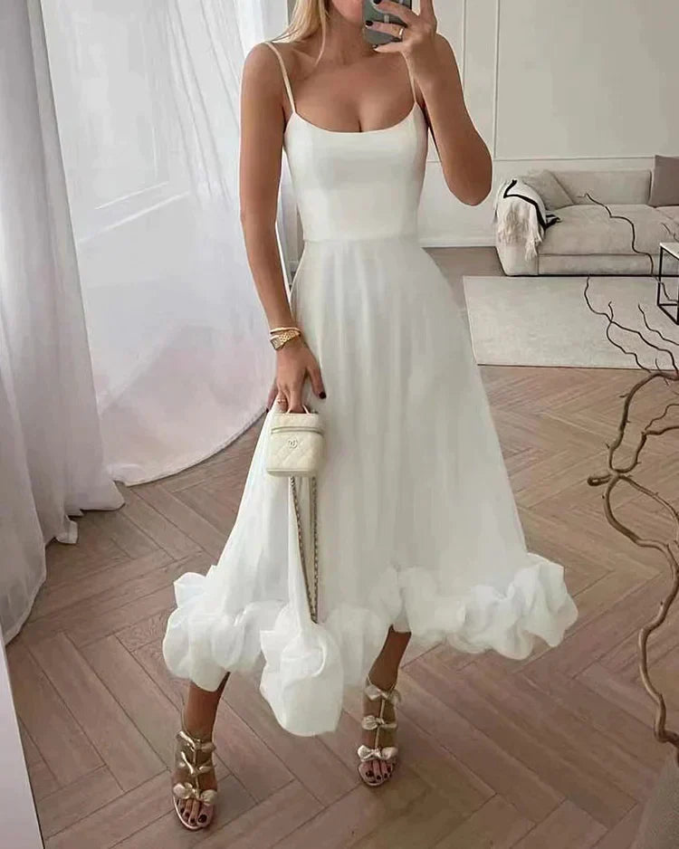 Lotta fitted sleeveless midi dress in white with voluminous ruffle hem