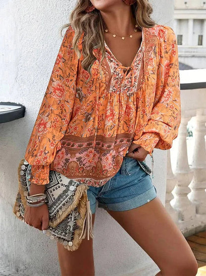 Women's Floral Long Sleeve Boho Blouse in Orange, front view with lace-up neck – Marzena