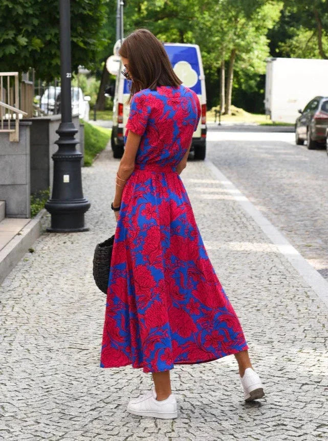 Women's Floral Maxi Wrap Dress in Blue and red print, back view on model - Perla