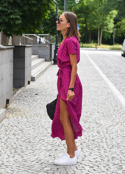 Women's Floral Maxi Wrap Dress in Red magenta print, side view with slit - Perla