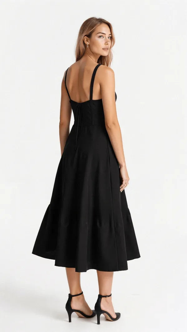 Back of the black Cerene midi dress showing shirred bodice and straps
