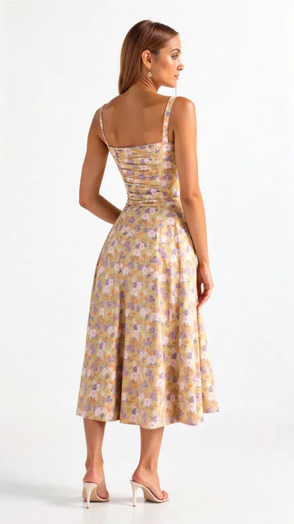 Back view of the yellow Cerene floral midi dress with ruched bodice
