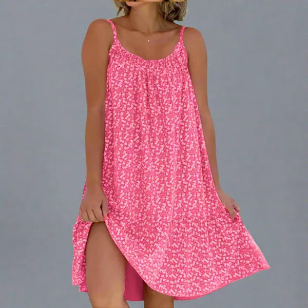 Ruby women's floral slip mini dress in pink, front view on model with side slit