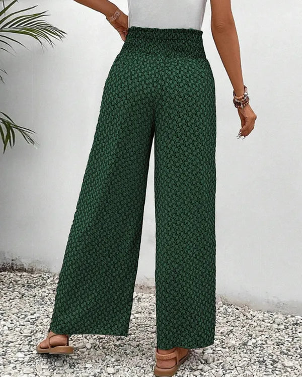 Lucie Women's Smocked Waist Palazzo Trousers in green floral print, back view