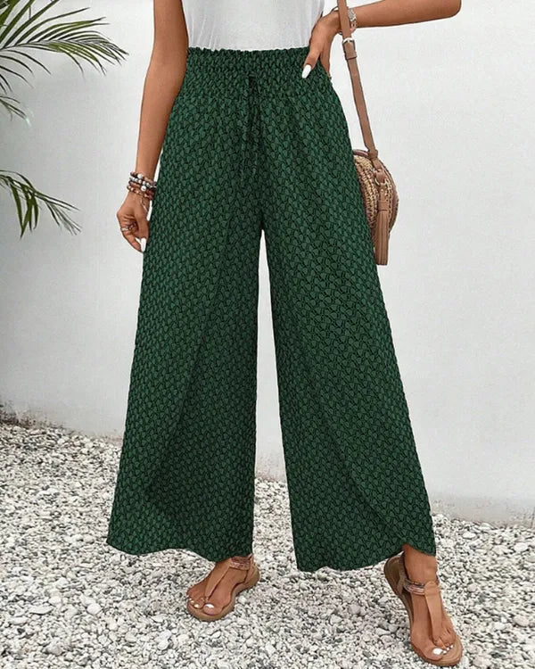 Lucie Women's Smocked Waist Palazzo Trousers in green ditsy floral, front view
