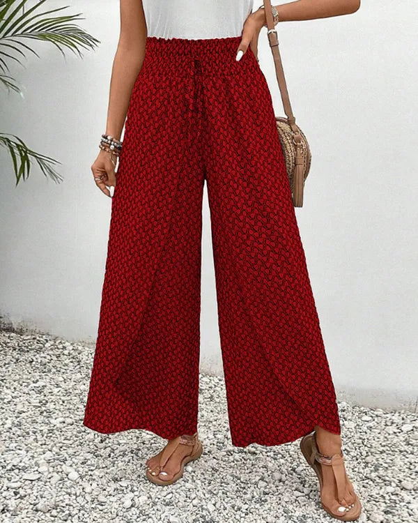 Lucie Women's Smocked Waist Palazzo Trousers in red ditsy floral, front view