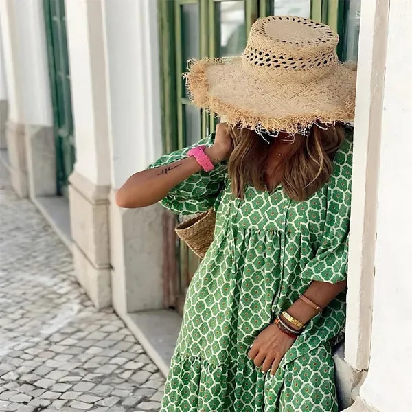Women's Floral Summer Maxi Dress in Green and white, close-up with straw hat - Isadora
