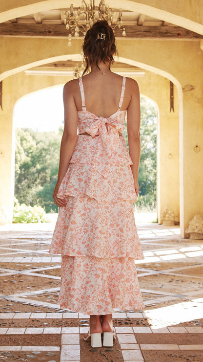 Back view of the pink Alessandra floral tiered midi dress with bow tie