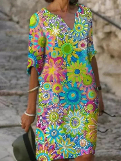 Zephyra floral V-neckline midi dress in green sunflower print, front view