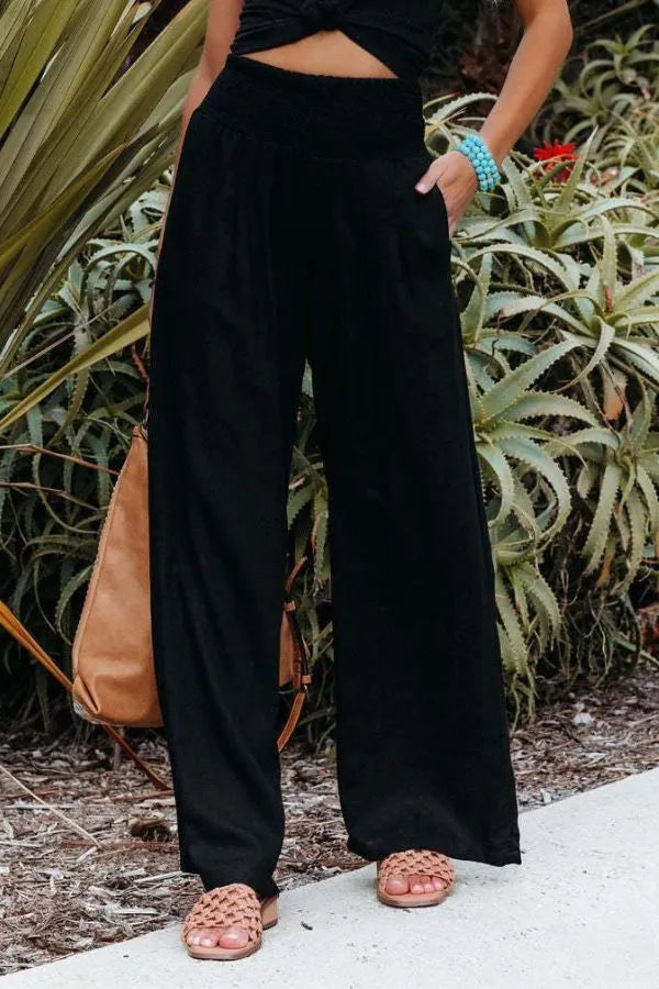 Bethany Women's Flowy Palazzo Trousers in black, front view on model