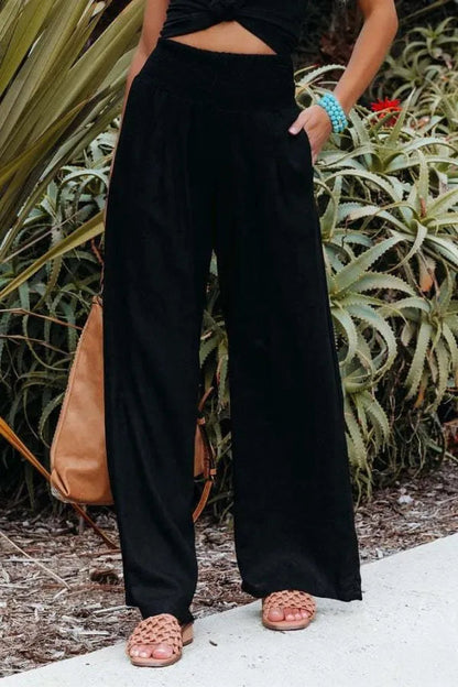Bethany Women's Flowy Palazzo Trousers in black, front view on model