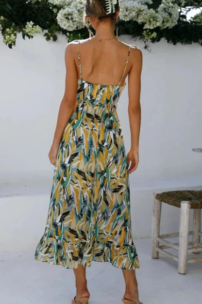 Back view of the green Ingrid flowy summer midi dress with open back