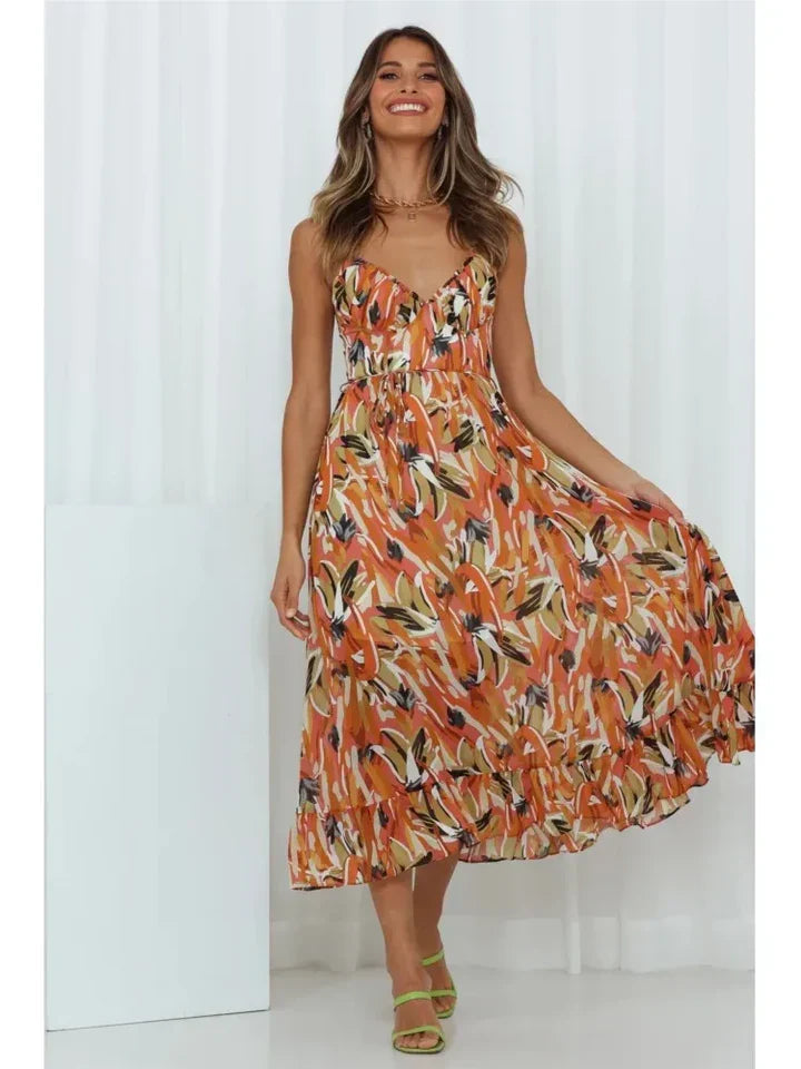 Ingrid orange floral summer midi dress with ruffled hem, studio front view