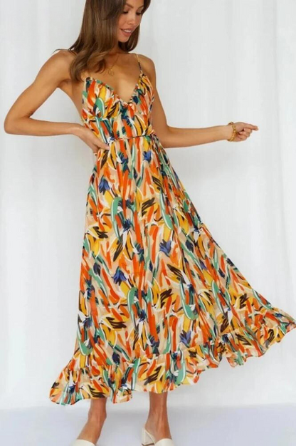 Orange Ingrid flowy summer midi dress with ruffled hem, front view indoors