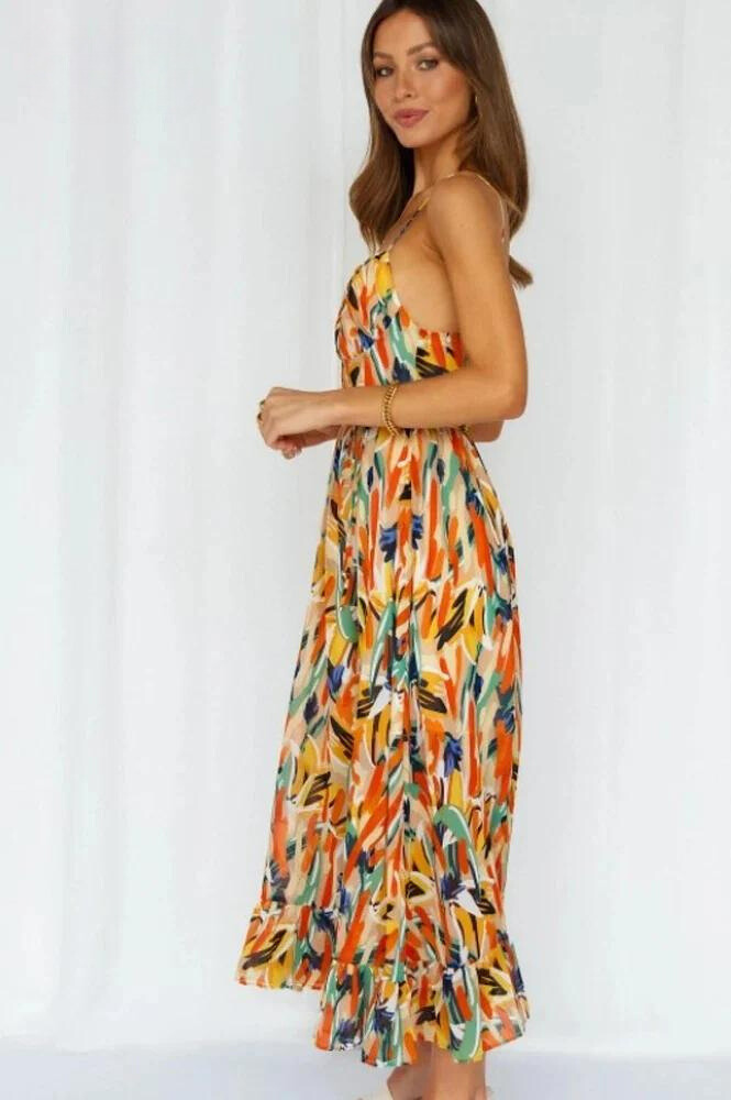 Side view of the orange Ingrid flowy summer midi dress with tiered hem