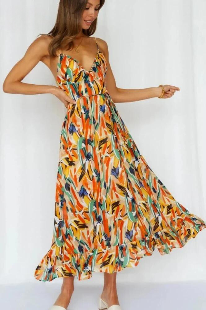 Ingrid flowy summer midi dress in orange, twirling front view indoors