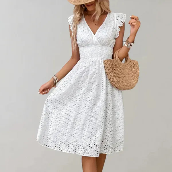 White Siri flutter sleeve midi dress styled with a straw bag, front view