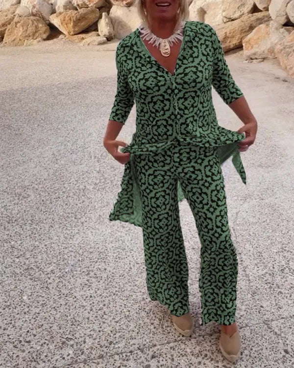Gavriella green geometric V-neck set, model holding side slit of tunic top