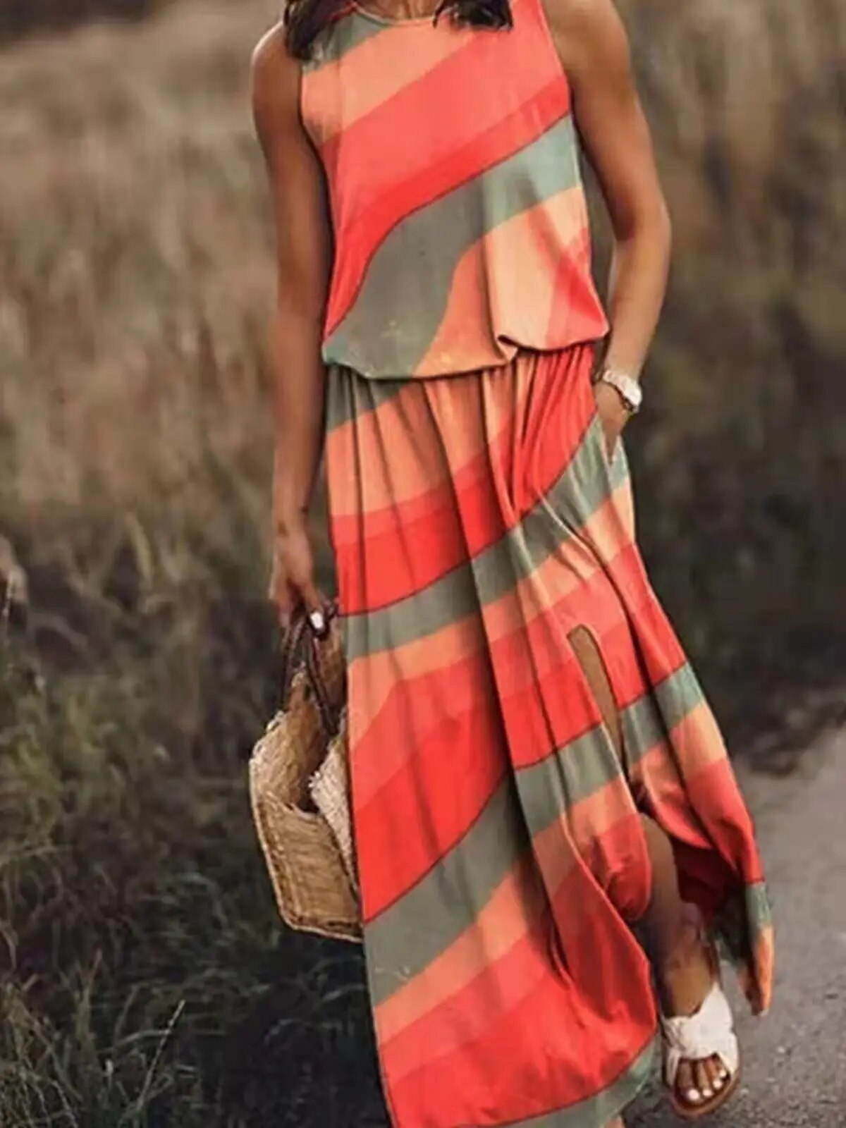 Striped Lucianna sleeveless maxi dress in coral and sage, side slit shown, front view
