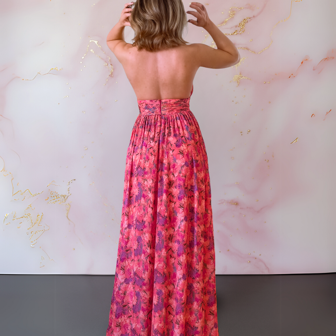 Amoret fuschia halter maxi dress shown from behind, fully backless bodice and long skirt