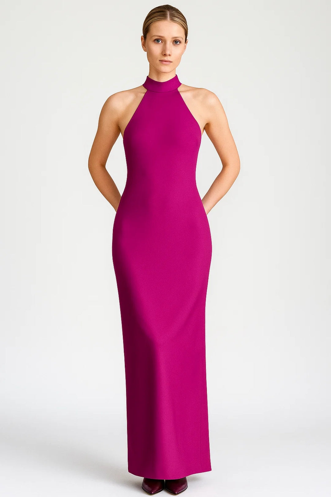 Hot pink Almodis halter neck maxi dress, slim column silhouette shown from the front