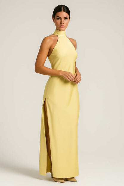Yellow Almodis halter neck maxi dress with side slit, front view on model in studio