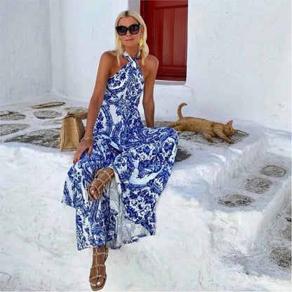 Belle blue print halter maxi dress worn seated, side view showing the tiered skirt