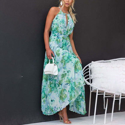 Bianca green floral halter pleated maxi dress, front view against a dark studio wall